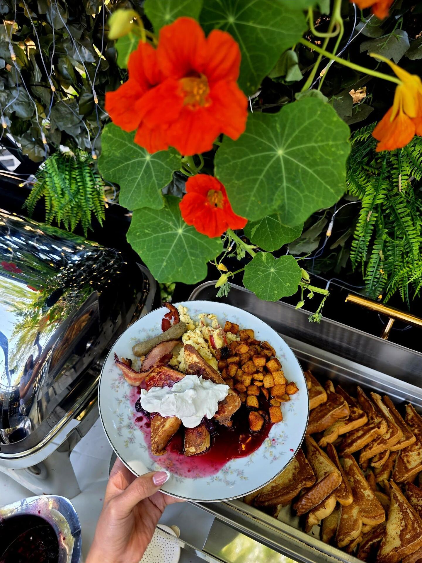 Sunday Brunch plate at Borracho's patio, surrounded by flowering shrubs