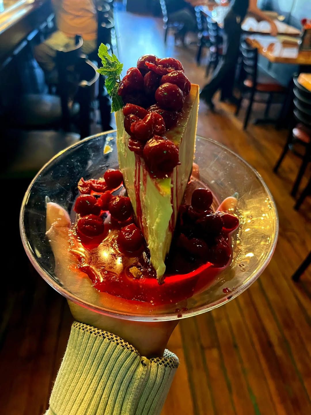 Slice of cherry cheesecake on a plate at Borracho's